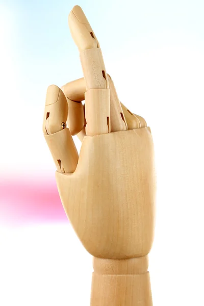 Wooden hand on light background — Stock Photo, Image