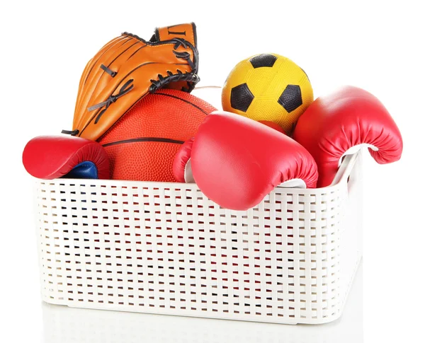 Plastic basket with sports equipment isolated on white — Stock Photo, Image