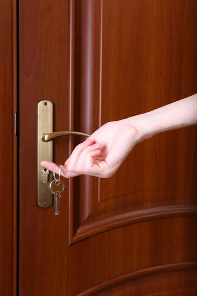 Locking up or unlocking door with key in hand — Stock Photo, Image