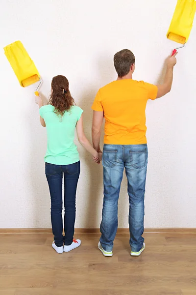 Young couple doing renovation in new house Stock Photo