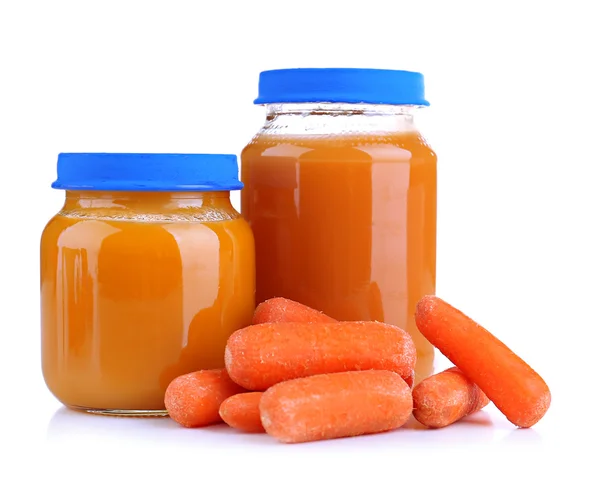 Baby food with carrot in glass jars, isolated on white — Stock Photo, Image