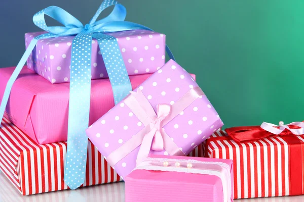 Various gift boxes on a colorful background — Stock Photo, Image