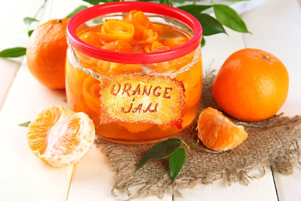 Orange jam with zest and tangerines, on white wooden table — Stock Photo, Image