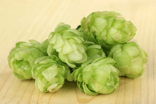 Fresh green hops, on wooden background — Stock Photo, Image