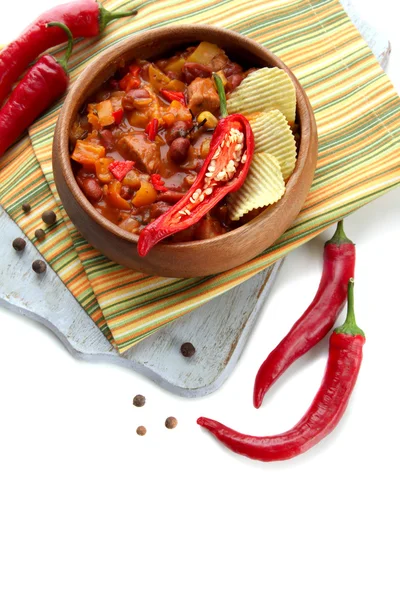 Chili Corn Carne - traditional mexican food, in wooden bowl, on napkin, isolated on white — Stock Photo, Image