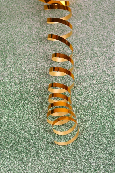 Golden ribbon on bright background — Stock Photo, Image