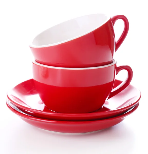 Rote Tassen isoliert auf weiß — Stockfoto