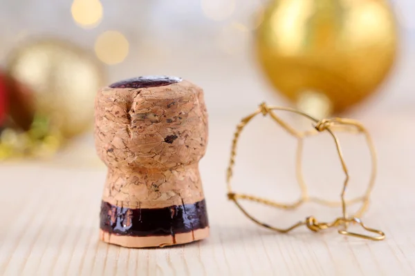 Champagne cork on Christmas lights background — Stock Photo, Image