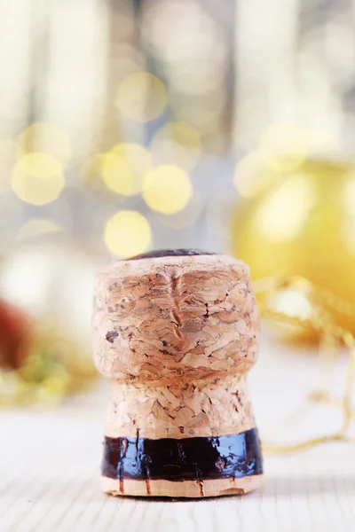 Champagne cork on Christmas lights background