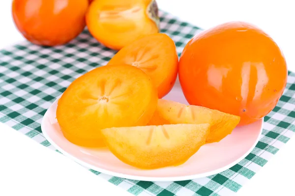 Ripe persimmons on plate close-up — Stock Photo, Image