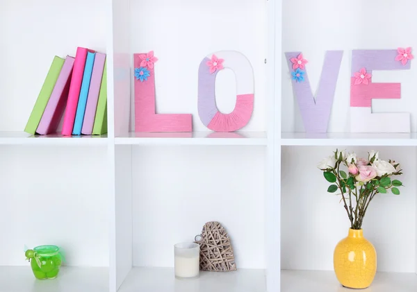 White shelves decorated with handmade knit word — Stock Photo, Image