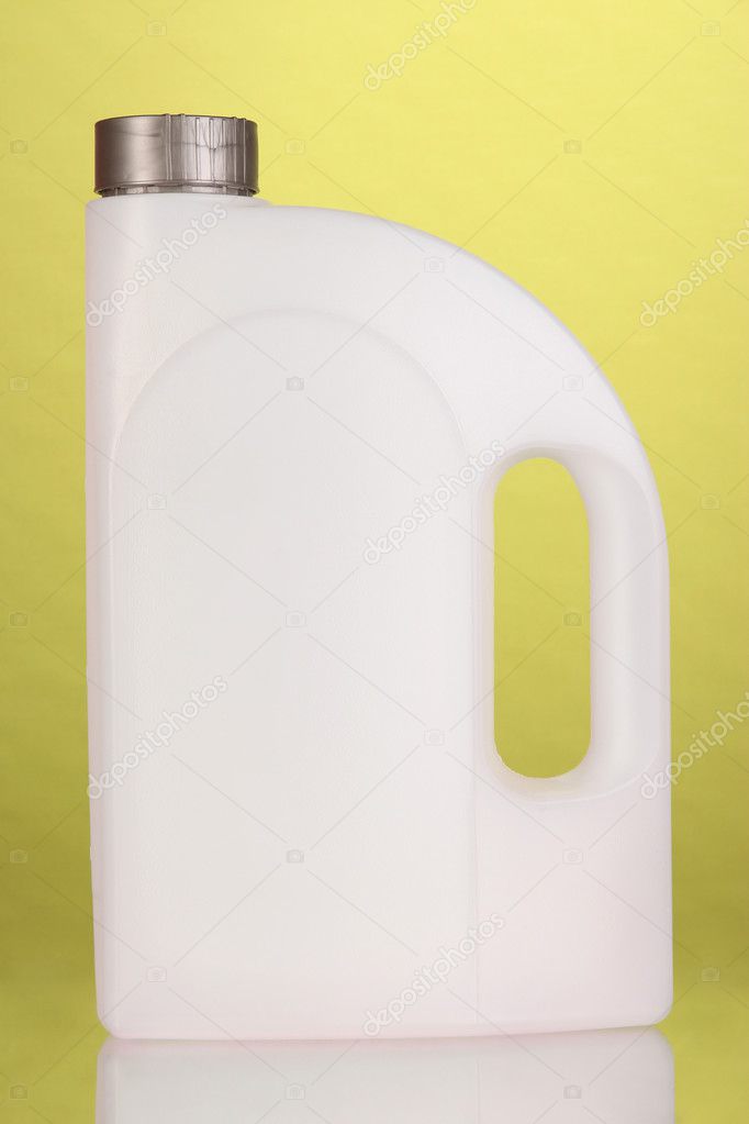 Plastic canister on green background