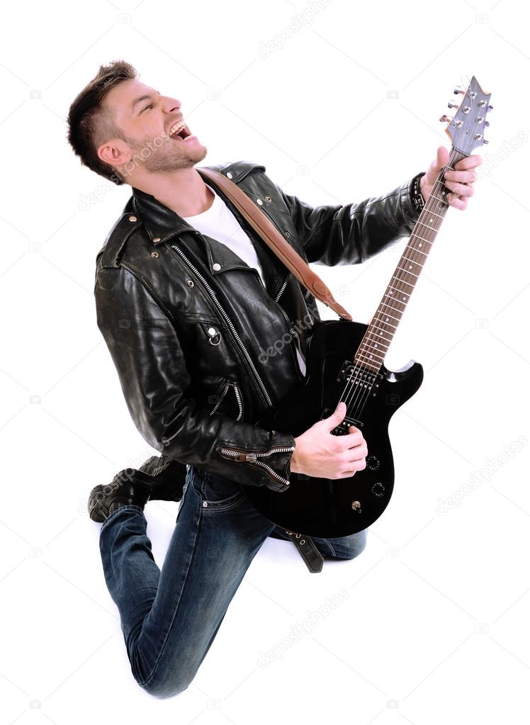 Young musician playing guitar, isolated on white