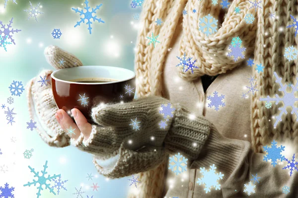 Female hands with hot drink, on light background — Stock Photo, Image