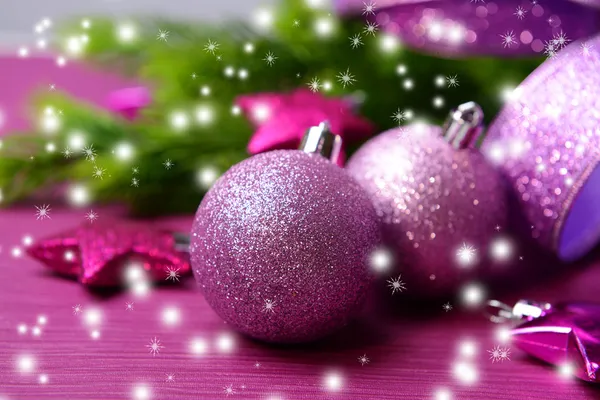 Christmas balls on fir tree, on color background — Stock Photo, Image