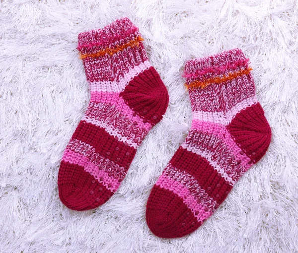 Woolen socks, on color background — Stock Photo, Image