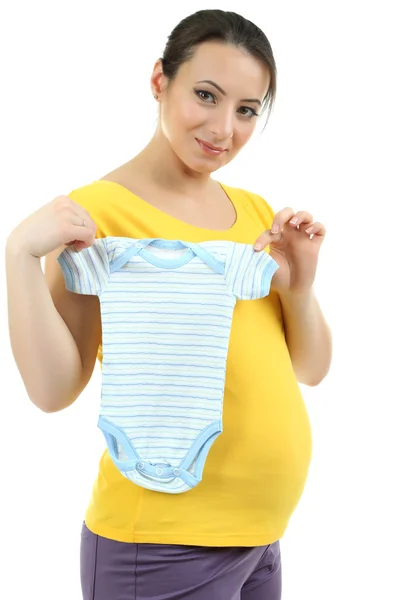 Young pregnant woman holding blue romper isolated on white — Stock Photo, Image