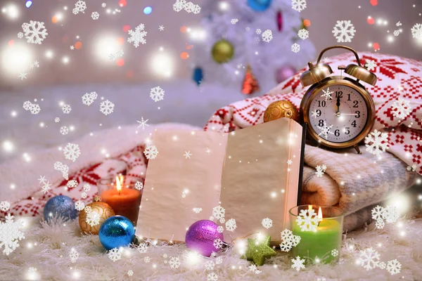 Composition with plaids, candles and Christmas decorations, on white carpet on bright background — Stock Photo, Image