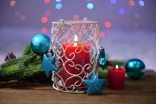 Candles and Christmas decoration on bright background — Stock Photo, Image