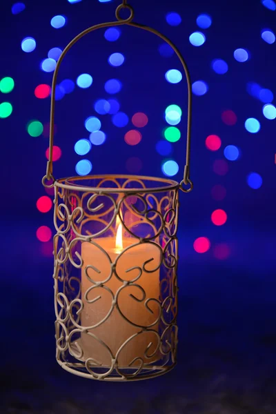 Candle on blur lights background — Stock Photo, Image