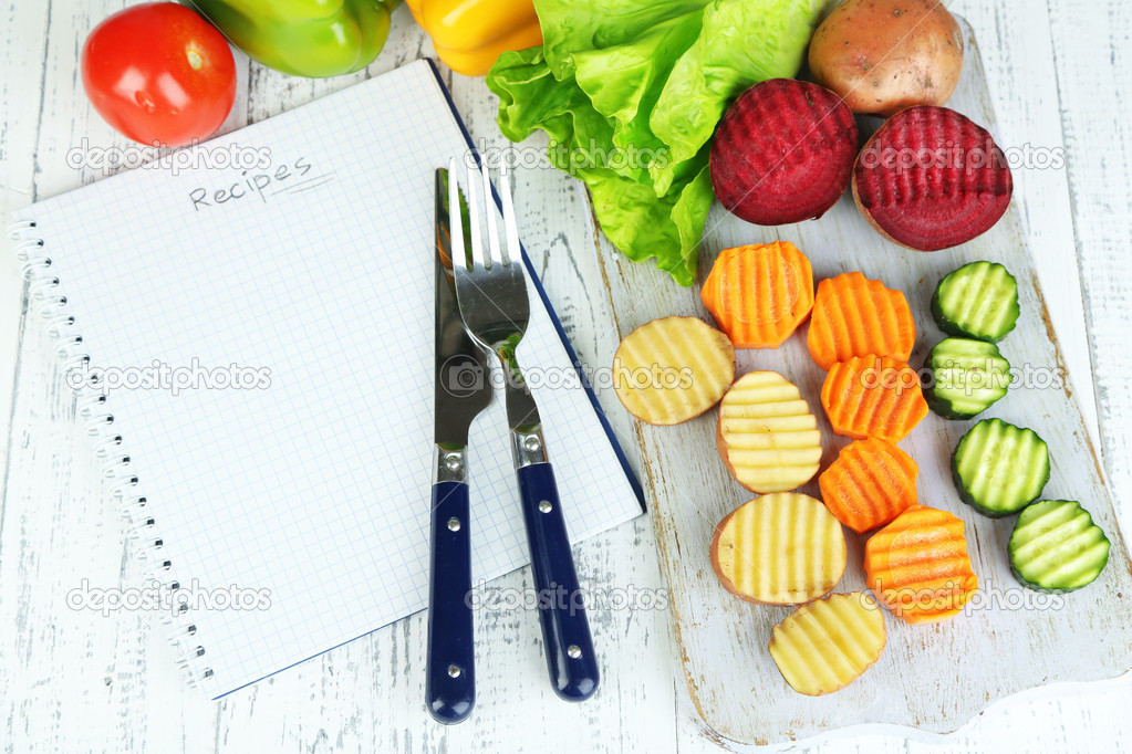 Beautiful sliced vegetables, on cutting board, on color background