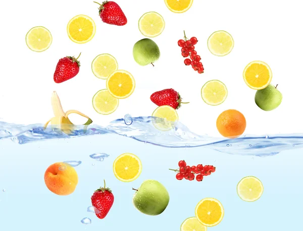 Fresh fruits dropped into water — Stock Photo, Image