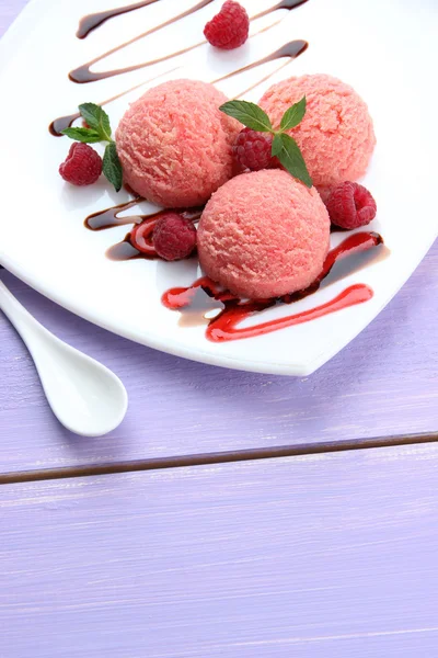 Delicious ice cream on plate on table close-up — Stock Photo, Image