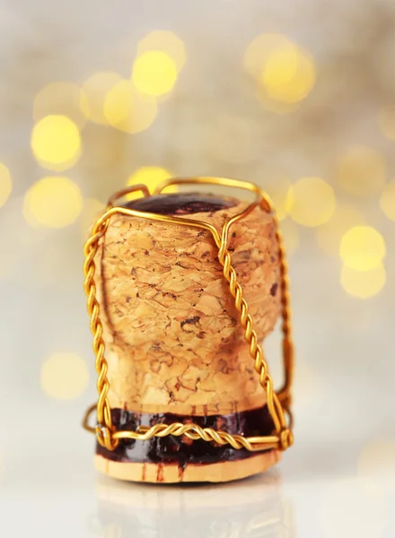 Champagne cork op Kerstmis licht achtergrond — Stockfoto