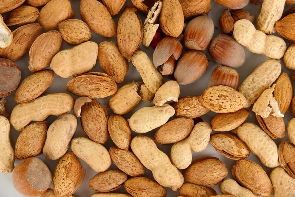 Many nuts close-up background — Stock Photo, Image