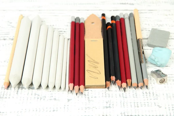 Professional art materials, on wooden table — Stock Photo, Image