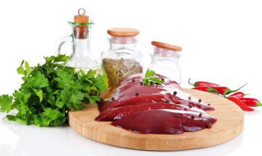 Raw liver on wooden board with spices and condiments isolated on white clipart
