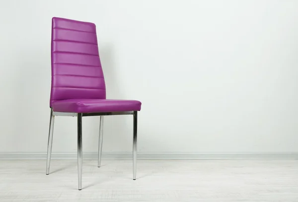 Modern color chair in empty room on wall background — Stock Photo, Image