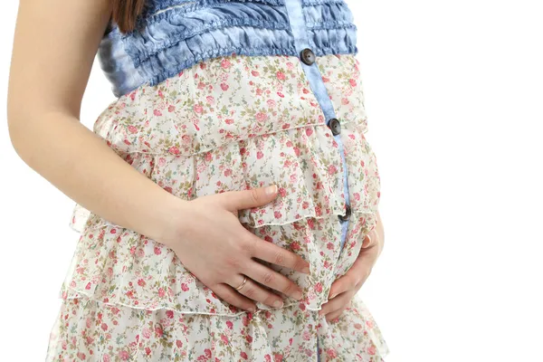 Zwangere vrouw aan haar buik op wit wordt geïsoleerd te raken — Stockfoto