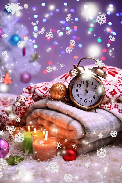 Composition with plaids, candles and Christmas decorations, on white carpet on bright background — Stock Photo, Image