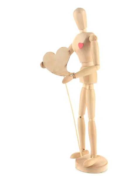 Wooden mannequin holding heart isolated on white — Stock Photo, Image
