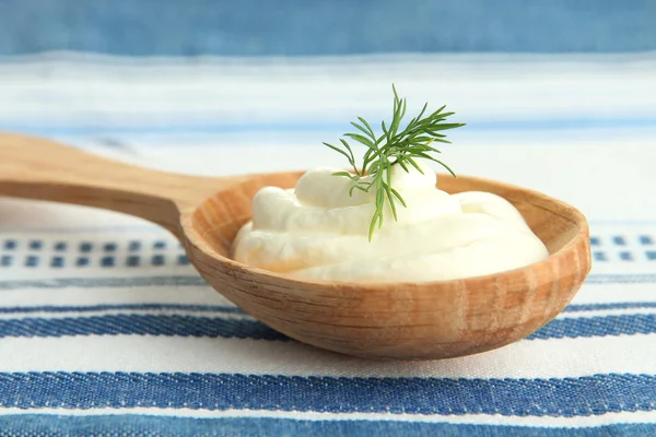 Sour cream in spoon close-up — Stock Photo, Image