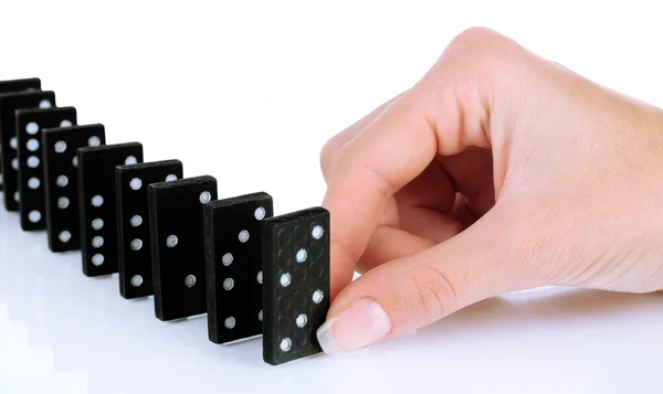 Hand spelar domino isolerad på vit — Stockfoto