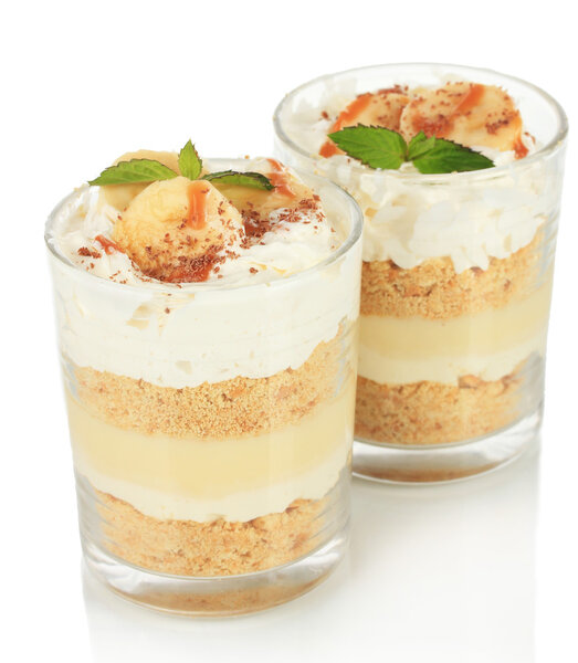 Delicious dessert with banana and caramel isolated on white