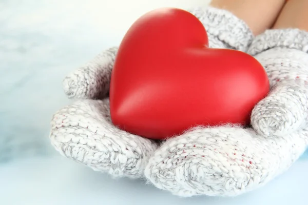 Female hands in mittens with heart, close-up — Stock Photo, Image