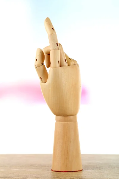 Wooden hand on light background — Stock Photo, Image