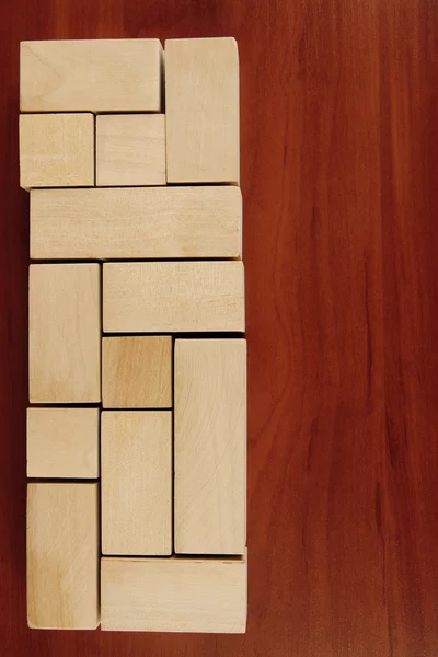 Wooden toy blocks on wooden background — Stock Photo, Image