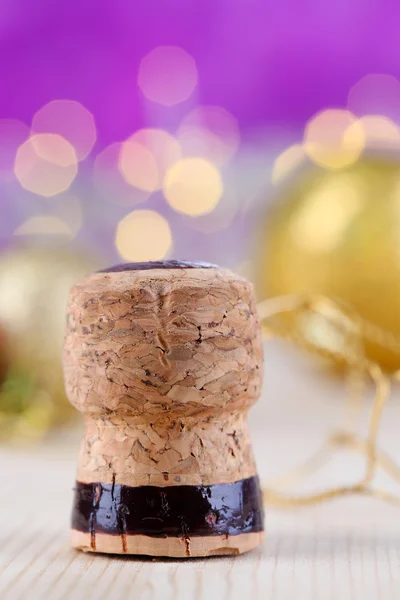 Champagne cork on Christmas lights background — Stock Photo, Image