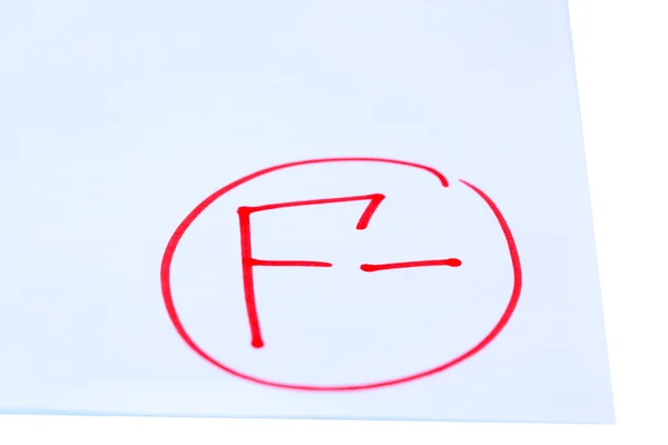 Grade F- written on an exam paper — Stock Photo, Image