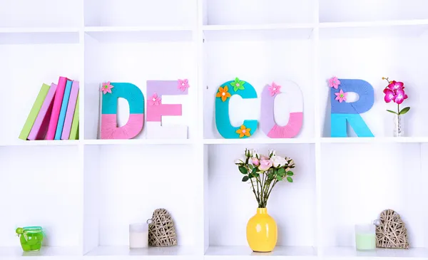 White shelves decorated with handmade knit word — Stock Photo, Image
