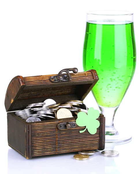 Glass of green beer and chest with coins isolated on white — Stock Photo, Image