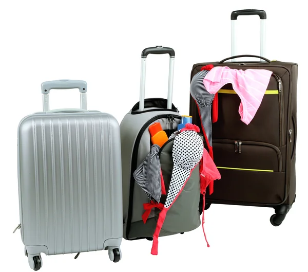 Suitcases with clothes isolated on white — Stock Photo, Image