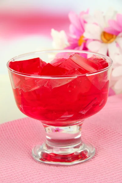 Tasty jelly cubes in bowl on table on light background — Stock Photo, Image