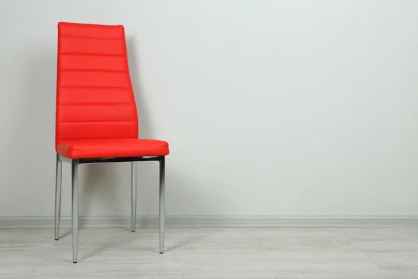 Modern color chair in empty room on wall background — Stock Photo, Image