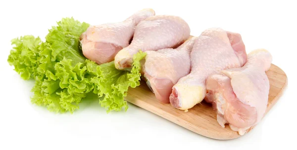 Raw chicken legs on wooden board isolated on white — Stock Photo, Image