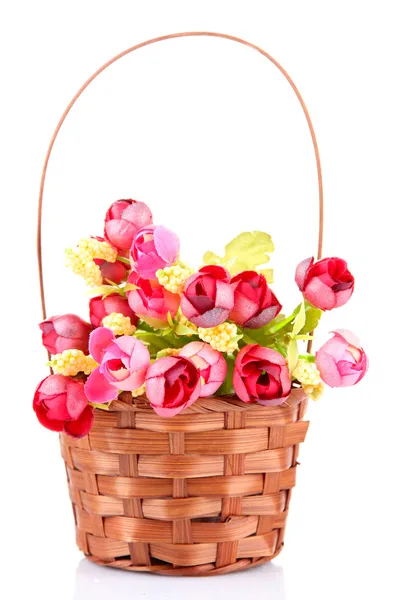 Bouquet of beautiful artificial flowers in wicker basket, isolated on white — Stock Photo, Image